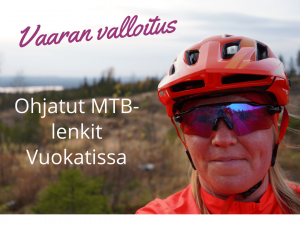 Anne Karhu Aluselta ohjaa maastopyöräilyä Vuokatissa vaaramaisemissa.